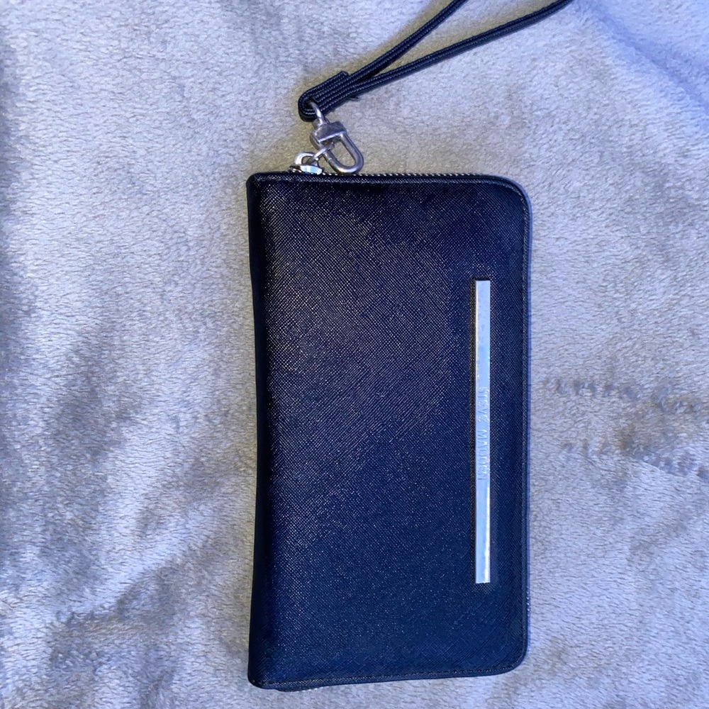This is a black leather Steve Madden hand wallet!